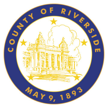 Seal of Riverside County featuring a historic building, surrounded by stars and the date May 9, 1893.